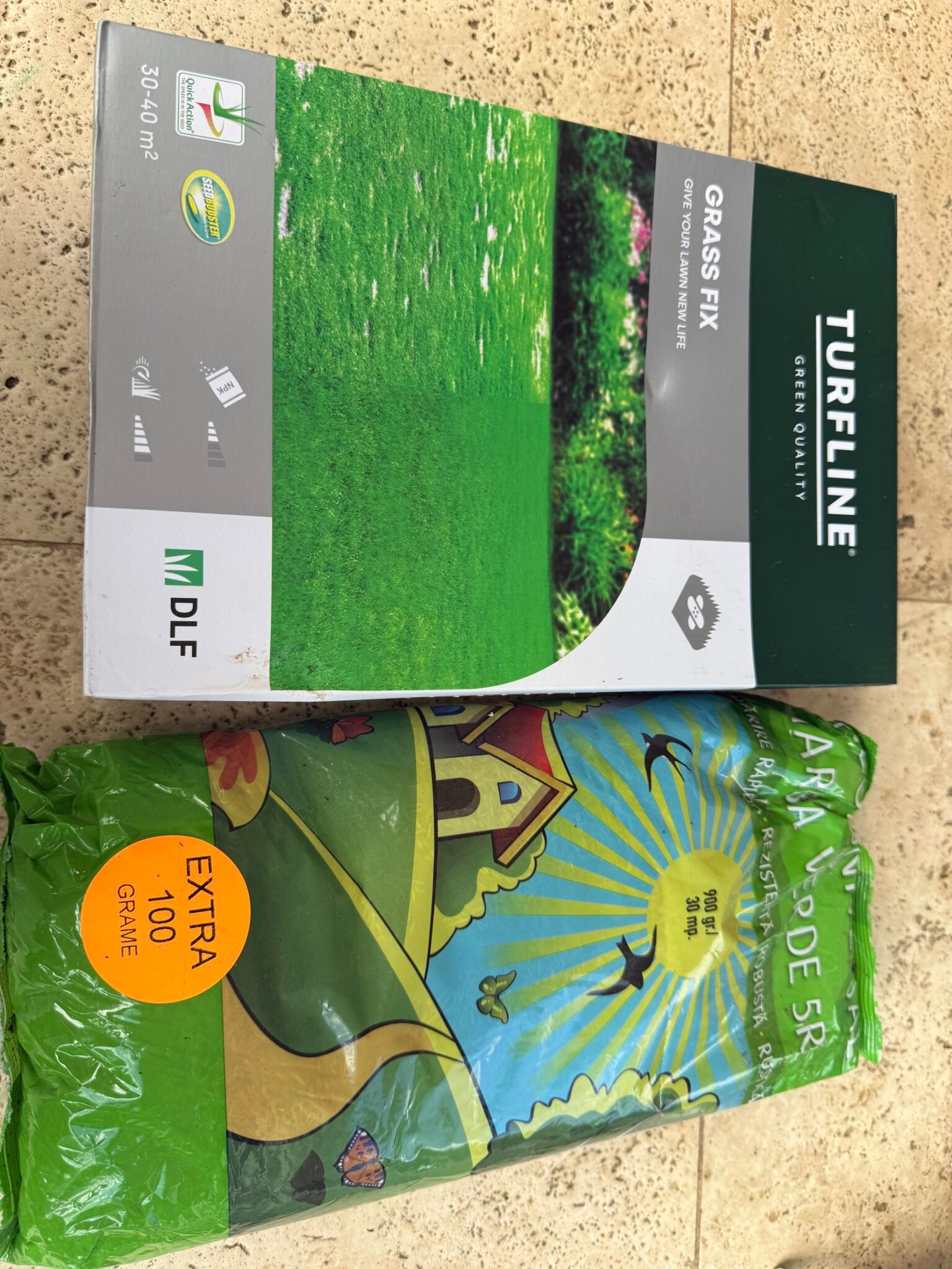 A box of DLF Turfline Grass Fix and a bag of EVERDE universal lawn seed used in the garden in Bran, Romania.